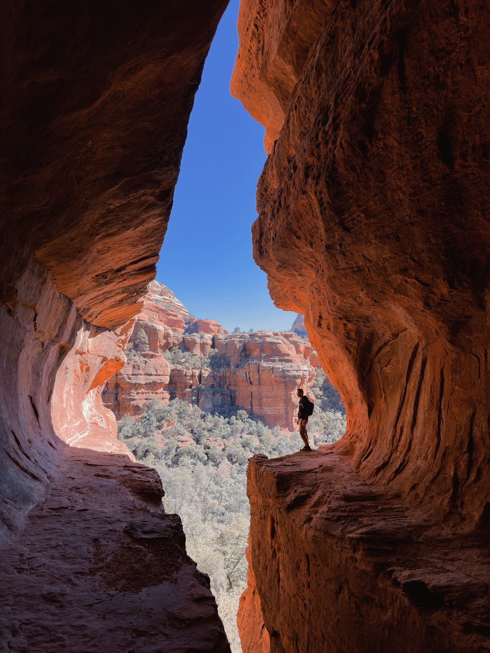 a man standing on a rock formation